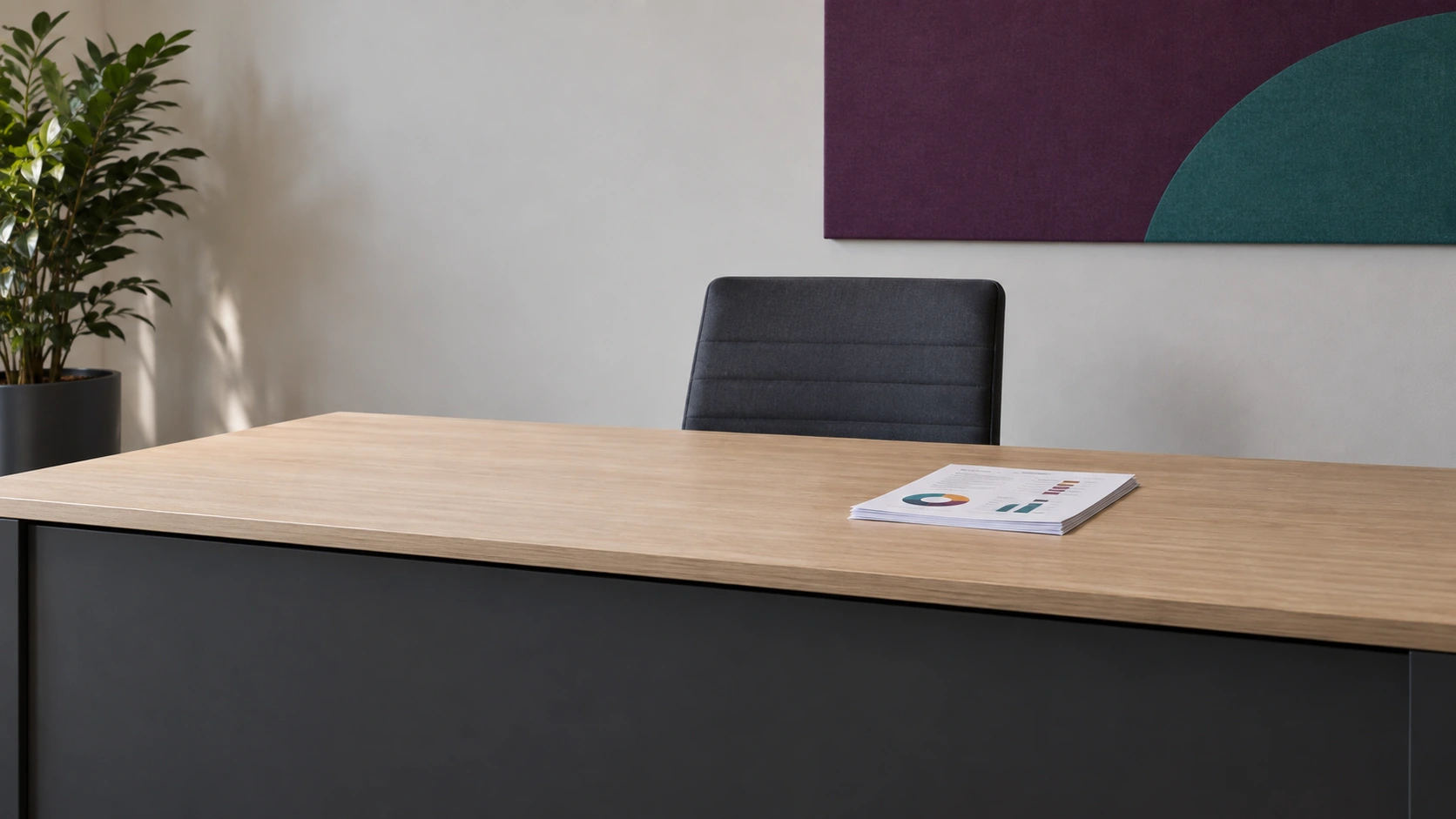 A4 business report on a clear executive desk with plum and teal office accents